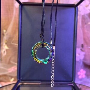 Necklace with Iridescent Cut Ring Appx 1.25 Inch Sphinx